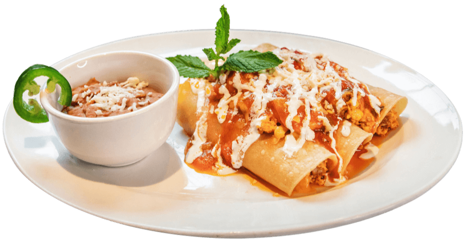 Southern breakfast enchiladas with sauce and crema at Ellen’s Southern Kitchen in Dallas