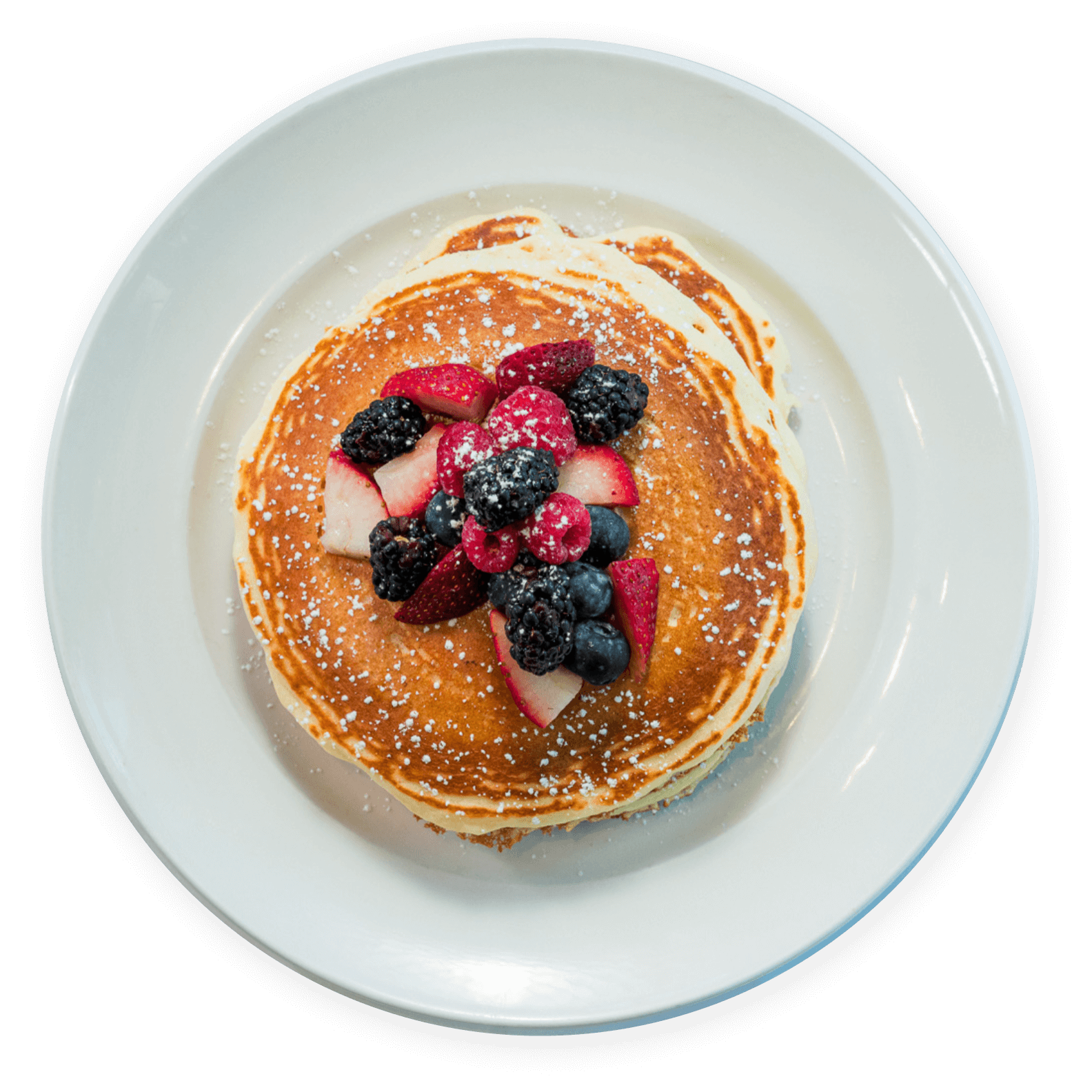 Buttermilk pancakes topped with fresh berries at Ellen’s Southern Kitchen in Dallas