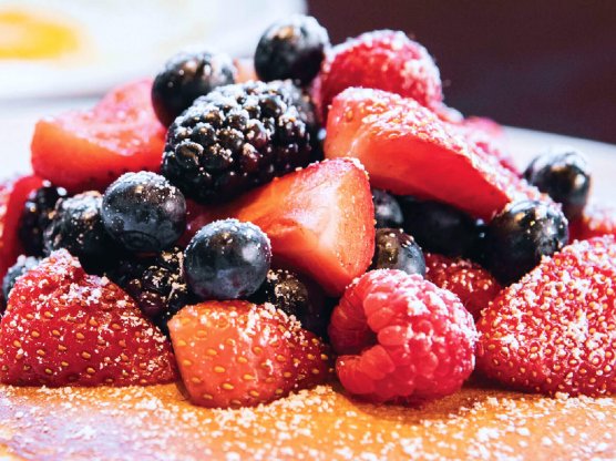 Buttermilk pancakes topped with fresh berries at Ellen’s